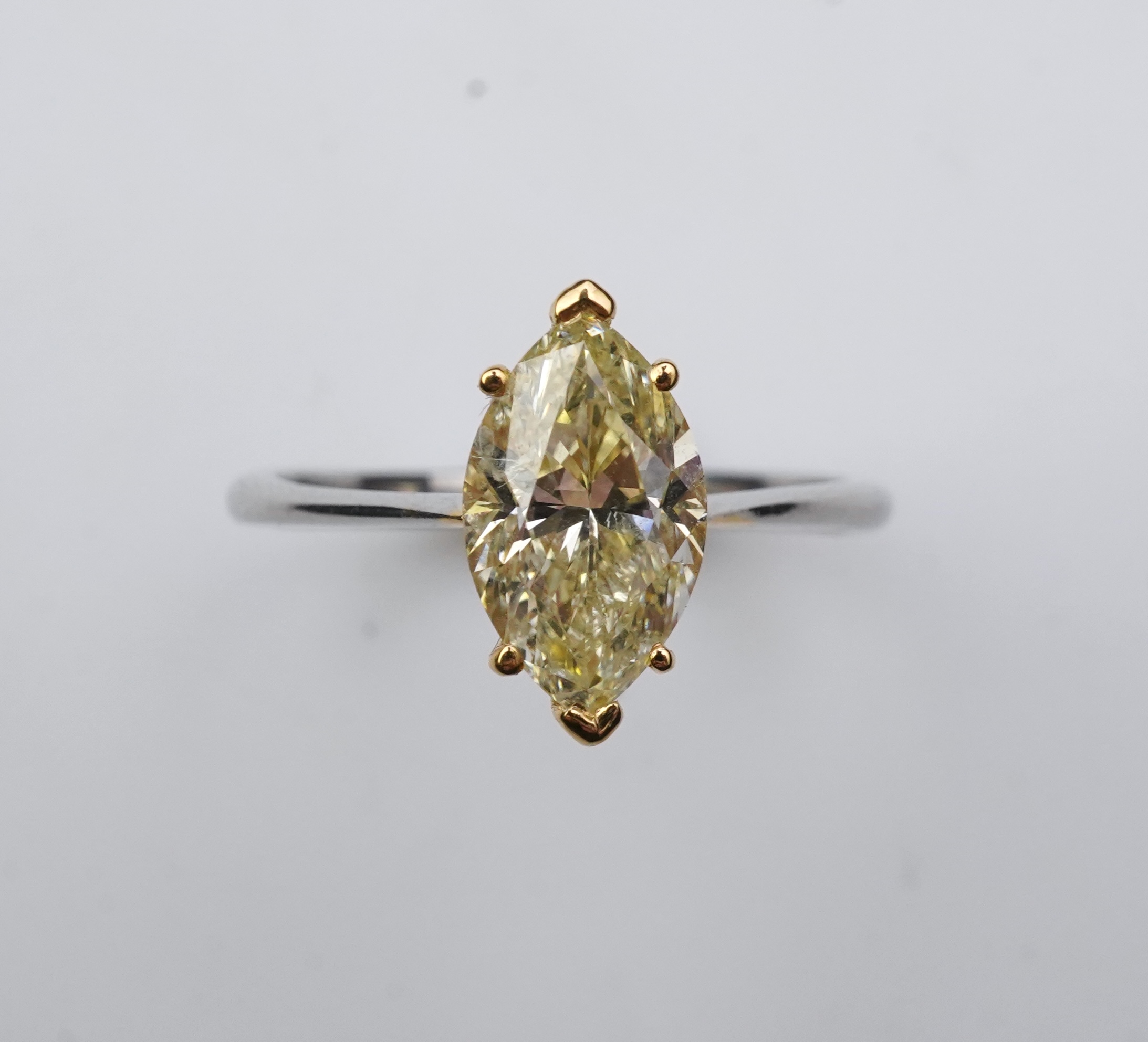 A yellow diamond solitaire ring